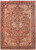 8'6" x 11' Persian Heriz rug with rust red field and navy stepped geometric medallion