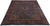 Signed Persian Kashmar rug 9'10" x 12'10" photographed at an angle on a white studio floor