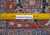 Back of the 10x13 Persian wool rug with ruler showing tight hand-knotted weave density