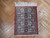 2' x 2'5" Persian Qum square rug displayed on herringbone parquet wood floor with ivory fringe
