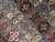 Close-up of turquoise, rose and ivory panels with tree of life and prayer arch motifs