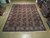 9 x 13 Persian Bakhtiar rug laid flat on light wood showroom floor, full overhead view