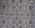 Close-up of cream field with palmettes, lotus blossoms and curling vine scroll in navy