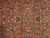 Detail of allover floral pattern in hand-knotted wool pile: rose, ivory, sage, navy