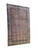 Angled full view of oversize ivory Kerman rug showing repeating boteh paisley and floral border