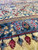 Soft blue paisley guard border beside ivory floral band on this hand-knotted Persian wool rug