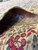 Rolled edge showing fine knot structure, cotton foundation and ivory selvage of the Kerman weave