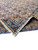 Folded corner of 9'9" x 15'10" Kerman rug showing paisley field and border layering