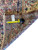Back of rug with tape measure and dealer tag confirming 10x16 oversize Persian dimensions