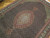 Close detail of salmon and gold medallion with ivory center rosette on hand-knotted Tabriz Mahi rug