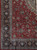 9 x 13 Persian Sarouk rug corner showing navy main border and ivory floral guard stripes