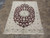 5'6" x 8'2" Persian Nain rug displayed on tile floor showing burgundy field and ivory borders