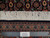 Ruler placed against 7x10 Tabriz rug fringe confirming authentic handmade hand-knotted Persian weave