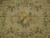 Close-up of the ivory center medallion with cream roses, yellow blossoms and soft green leaves