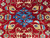 Close-up of sky blue cloud-band palmette surrounded by gold blossoms on lustrous red wool pile