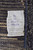 Original workshop tag reading 14'9 x 9'9, hand-knotted in Pakistan, 100% natural wool, Moroccan pattern