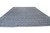 Oversize 15x20 hand-knotted wool rug shown at an angle with gray fringe and denim blue field