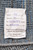 Back label reading 20'3 x 14'7, hand-knotted in Pakistan, 100% natural wool, Moroccan modern pattern