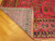 Folded corner showing tight cotton foundation and even hand-knotted back of this wool rug