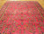 Large 10x14 Persian Sarouk rug angled view showing detached floral sprays and olive green accents