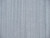 Macro texture shot of the 3/8 inch grey wool pile and dense hand-knotted rows