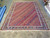 10'4" x 14'2" flat weave wool rug laid out for a full length view