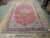 9'1" x 16' Persian Najafabad rug photographed flat on warehouse floor showing full oversize proportions