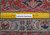Back of the 11'4" x 15'9" Tabriz rug with ruler confirming authentic hand-knotted wool weave