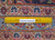 Ruler on 10'2" x 16'7" Kashan rug border proving authentic handmade wool pile and knot density