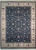 Full overhead view of graphite black hand-knotted rug with ivory floral border and cream fringe