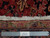 Back and fringe detail with ruler confirming hand-knotted wool weave on cotton foundation