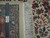 Back of the rug with ruler and Authentic Hand Knotted tag showing tight weave