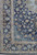 9'4" x 12'8" navy Kashan rug corner with layered ivory guard borders and palmette vines