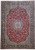 11'4 x 16'1 Persian Isfahan rug with red field, ivory medallion and navy floral border