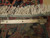Back of the rug with ruler showing knot rows and cotton foundation weave