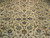 Close up of ivory field detail showing sky blue rosettes, lotus palmettes and fine wool pile
