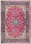 Red field Persian Isfahan rug with navy floral border, ivory spandrels and detailed central medallion