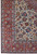 Corner detail showing multiple guard borders, ivory field florals and finely drawn scrolling wool vines