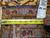 Tape measure and inventory tag 5331 against the tight hand-knotted weave of this Kashan