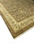 Angled corner detail showing hand-knotted wool pile, leafy border palmettes and rust inner stripe