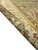 Rolled edge revealing dense even knotting on cotton foundation and short 3/8 inch pile