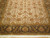 Traditional 9x12 Persian rug corner detail showing dense floral field and chocolate border