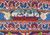 Woven signature cartouche in the upper border of this signed hand-knotted Persian Kashan rug