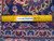 Back of the 9'10" x 13'4" Kashan rug with ruler showing hand-knotted wool knot density