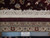 Ruler beside fringe and pile showing fine knot rows and Authentic Hand Knotted quality tag
