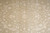 Detail of ivory palmettes and arabesque scrollwork woven in lustrous silk over a wool ground