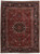 Full view of 8'2" x 11'1" Persian Heriz rug, black medallion on brick red field