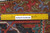 Back of the 8x11 Heriz rug with ruler proving hand-knotted wool pile and cotton foundation