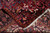 Back of the Heriz rug folded to show even knotting, cotton foundation and hand-tied fringe