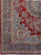 Corner detail with paisley spandrel, rose and blue floral guard borders, low even pile